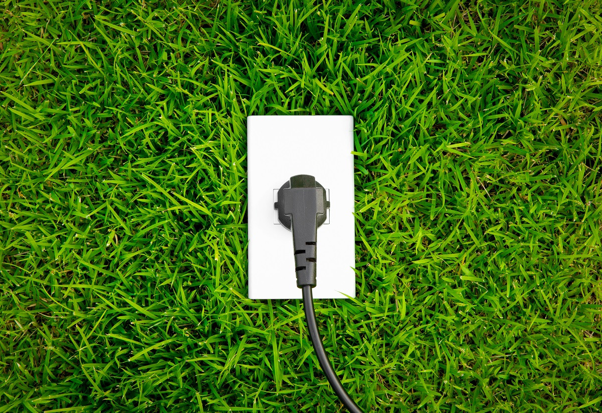 Energy concept outlet fresh spring green grass